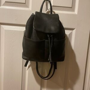 Tignanello Leather Black small Backpack string straps closure.
